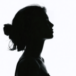 make a black and white picture of a woman where you can\'t see her face and only the outline of her body